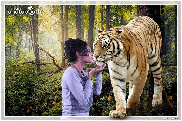 Sexy girl Model in the jungle with tiger in the background with green screen effect